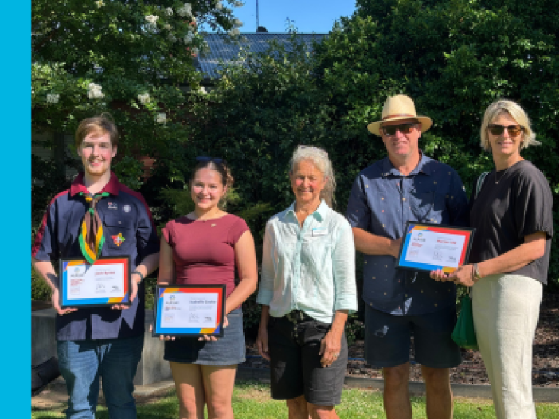 A young man and woman stand to the left of Alpine Shire Mayor, Cr Sarah Nicholas. To the front, an older man and woman. The Community Award recipients are each holding a certificate.