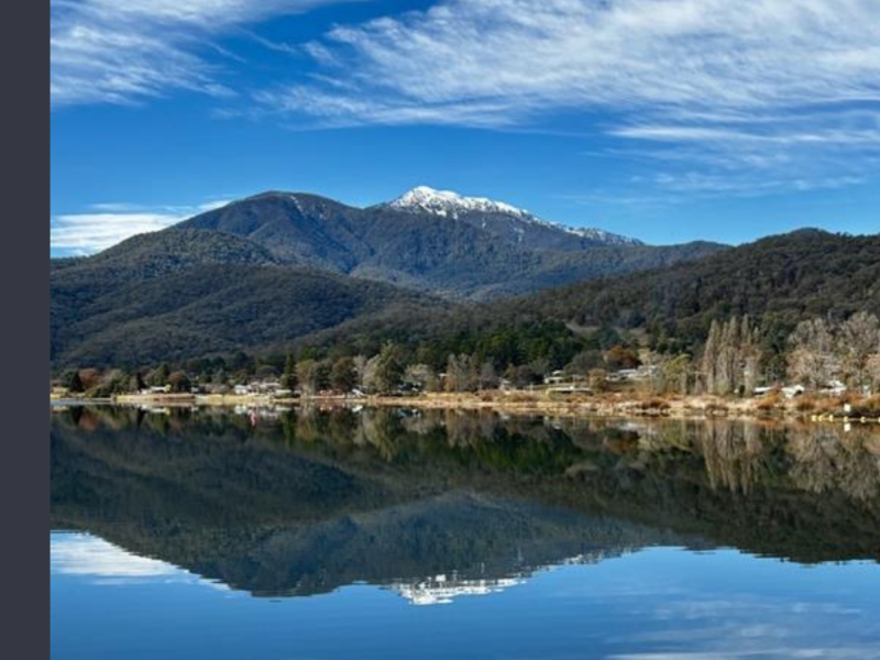 Mount Beauty Pondage with a snowcapped Mount Bogong reflected in the water