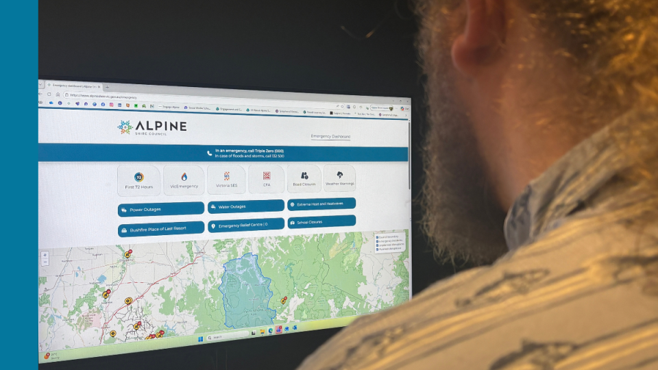 A person looks at a screen with an Emergency Dashboard displayed on it.
